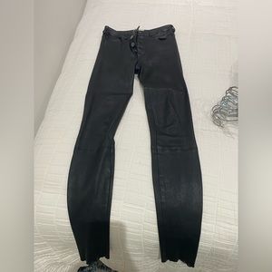 High rise black skinny leather (100% lamb skin) pants. Size 0. Worn Twice.